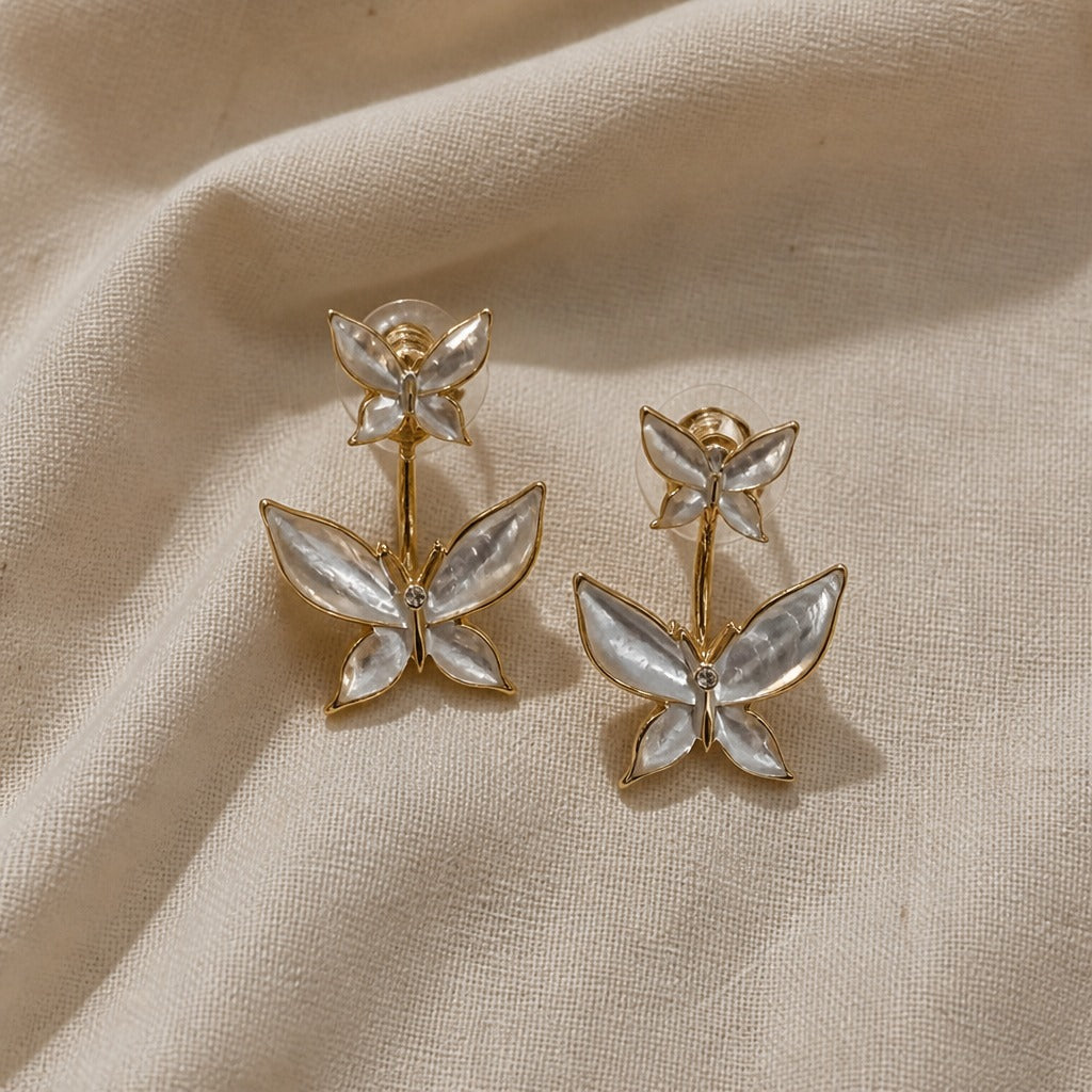 Boucles d'oreilles en or avec papillon en perles